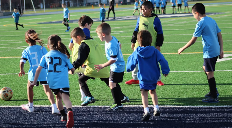 Young WCOB players building their soccer skills during a development session