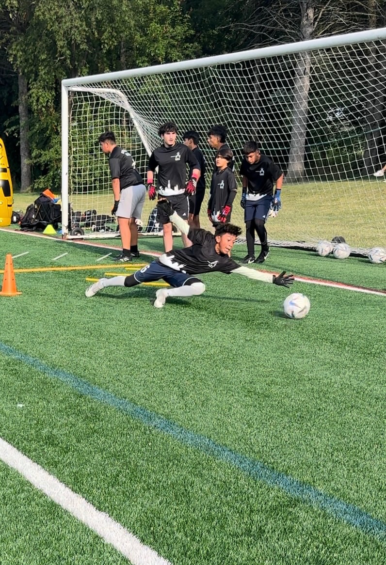 WCOB goalkeeper reaching for the ball during a diving drill